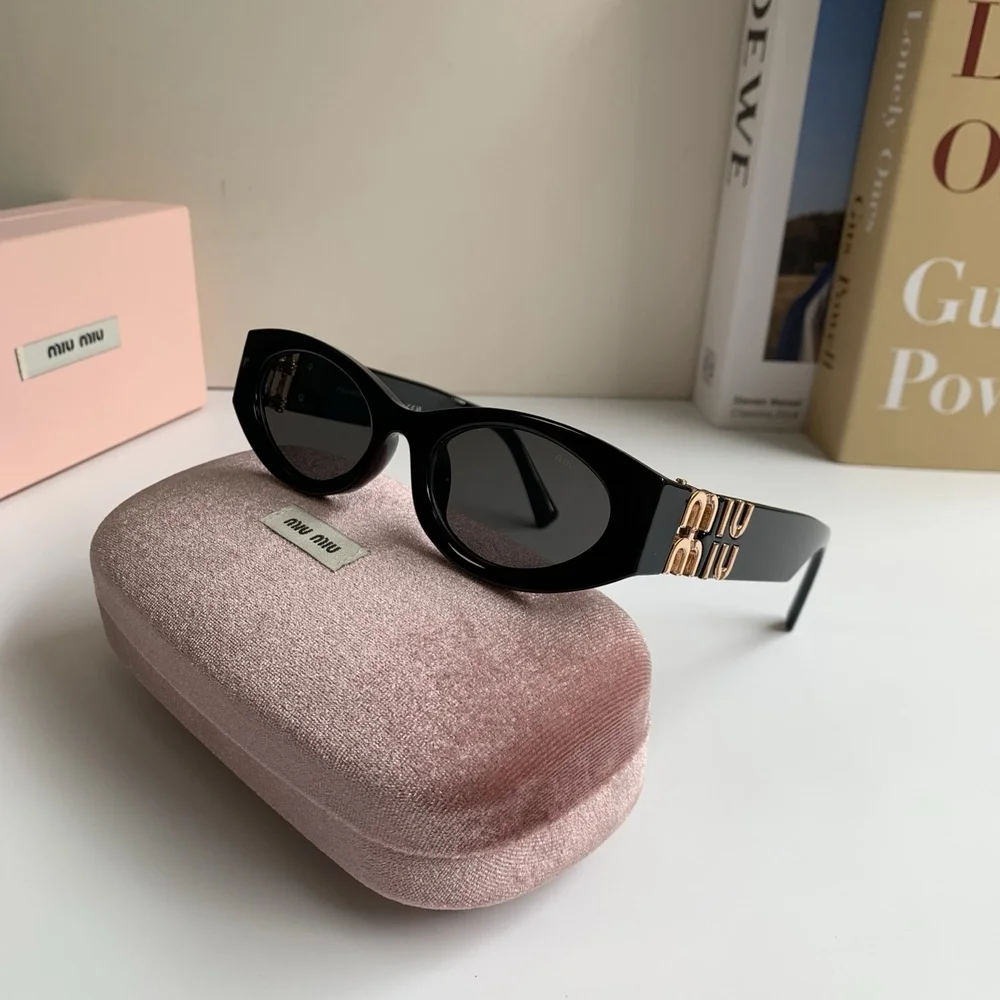 Miu Miu black sun protection sunglasses and aviator sunglasses